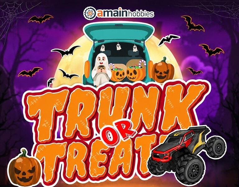 Halloween-themed RC cars and decorations at AMain Hobbies' Trunk or Treat event, featuring pumpkins, bats, and spooky background.