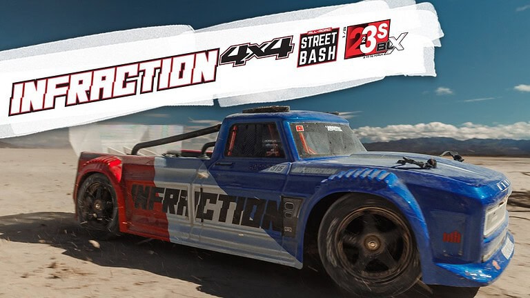 RC Infraction 1/8 V4 performing high-speed stunts on dirt track.