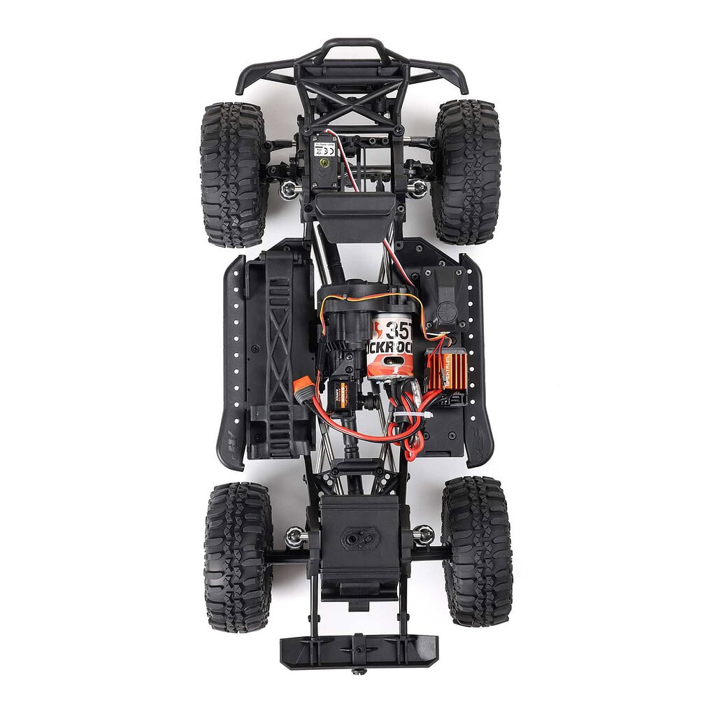 Detailed view of the Axial SCX10 III 1987 Toyota SR5 RTR trail truck chassis, showcasing its rugged off-road design and high-performance components for RC enthusiasts.