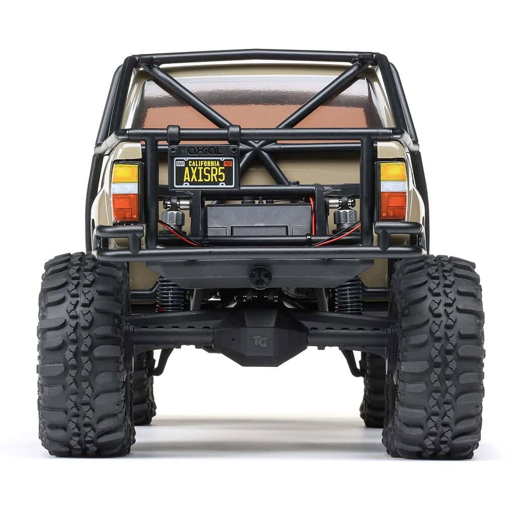 AXIAL SCX10 III 1987 Toyota SR5 RTR off-road RC truck with rugged tires and detailed body. Perfect for trail crawling and RC hobby enthusiasts.