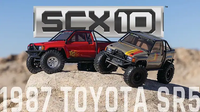 Detailed view of the Axial SCX10 III 1987 Toyota SR5 RC crawler on rocky terrain, showcasing its realistic design and off-road capabilities for RC enthusiasts.