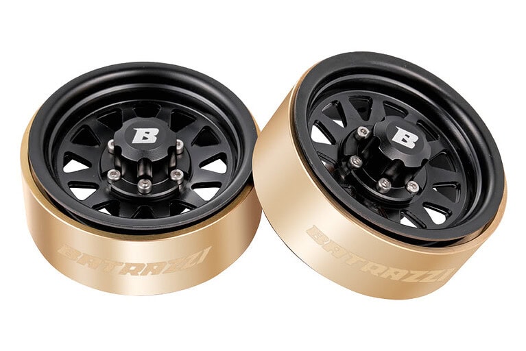 Two RC car wheels with black rims and gold-colored outer rims, featuring BTRAXX branding, designed for high-performance remote control vehicles.