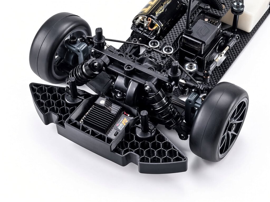 Close-up of the Carisma M40F FWD mid-motor on-road RC chassis kit showing detailed components and construction.