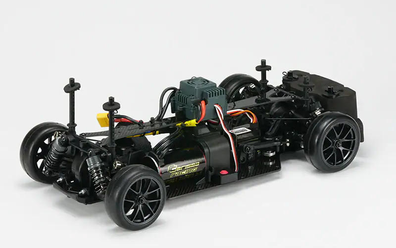Quality RC car chassis featuring electronic components, suspension, and durable tires, ideal for hobbyists and remote control racing enthusiasts.