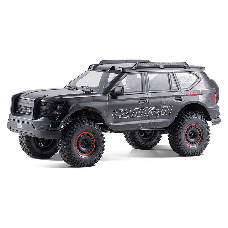 Off-road RC crawler vehicle modeled after a rugged SUV with large tires, durable design, and canyon-themed graphics, perfect for off-road adventures and RC hobby enthusiasts.