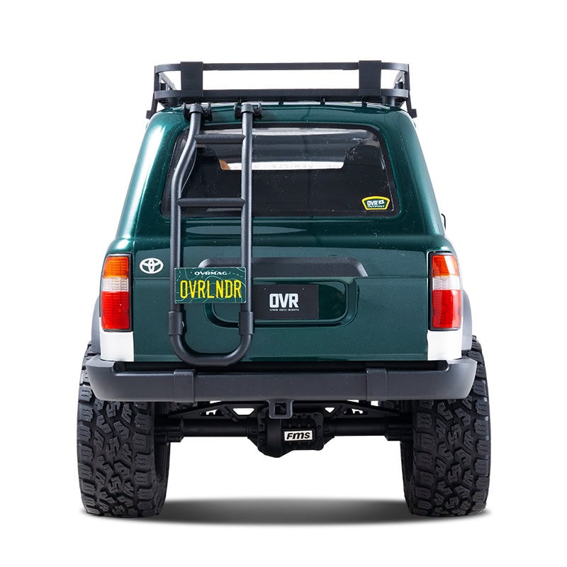 Detailed view of the FMS FCX10 Toyota Land Cruiser 80 Brushless OVR Edition RC car, showcasing its rugged design, off-road tires, and realistic details for RC enthusiasts.