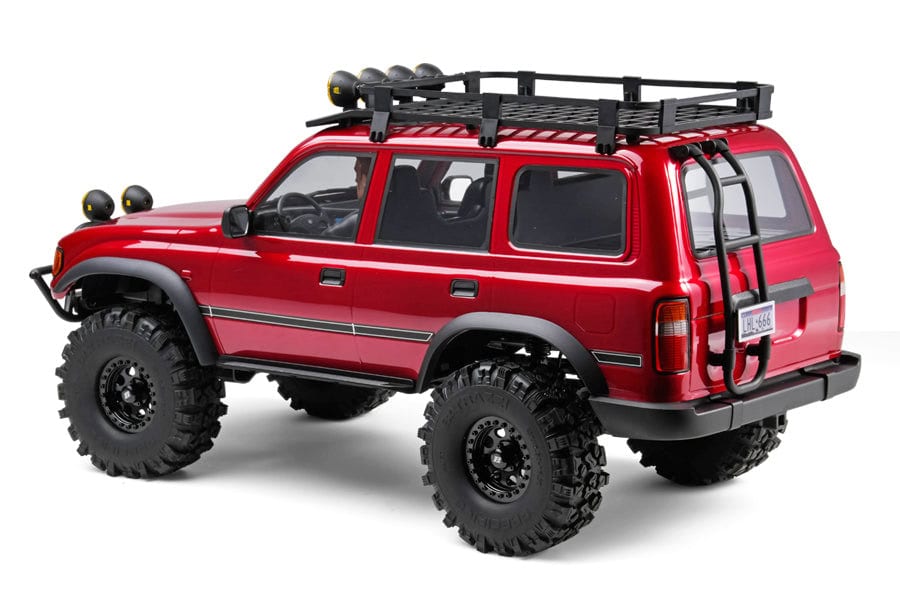 RC off-road vehicle with rugged tires, roof rack, and rear ladder for outdoor adventures.