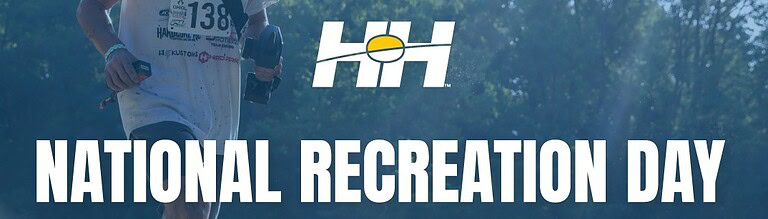 RC hobbyist running during National Recreation Day event, holding remote control in hand, outdoor RC car racing action, RC Newb community, hobby enthusiasts, outdoor RC activities, remote control racing, recreational RC cars, outdoor RC adventures, RC enthusiasts, RC car event photo.