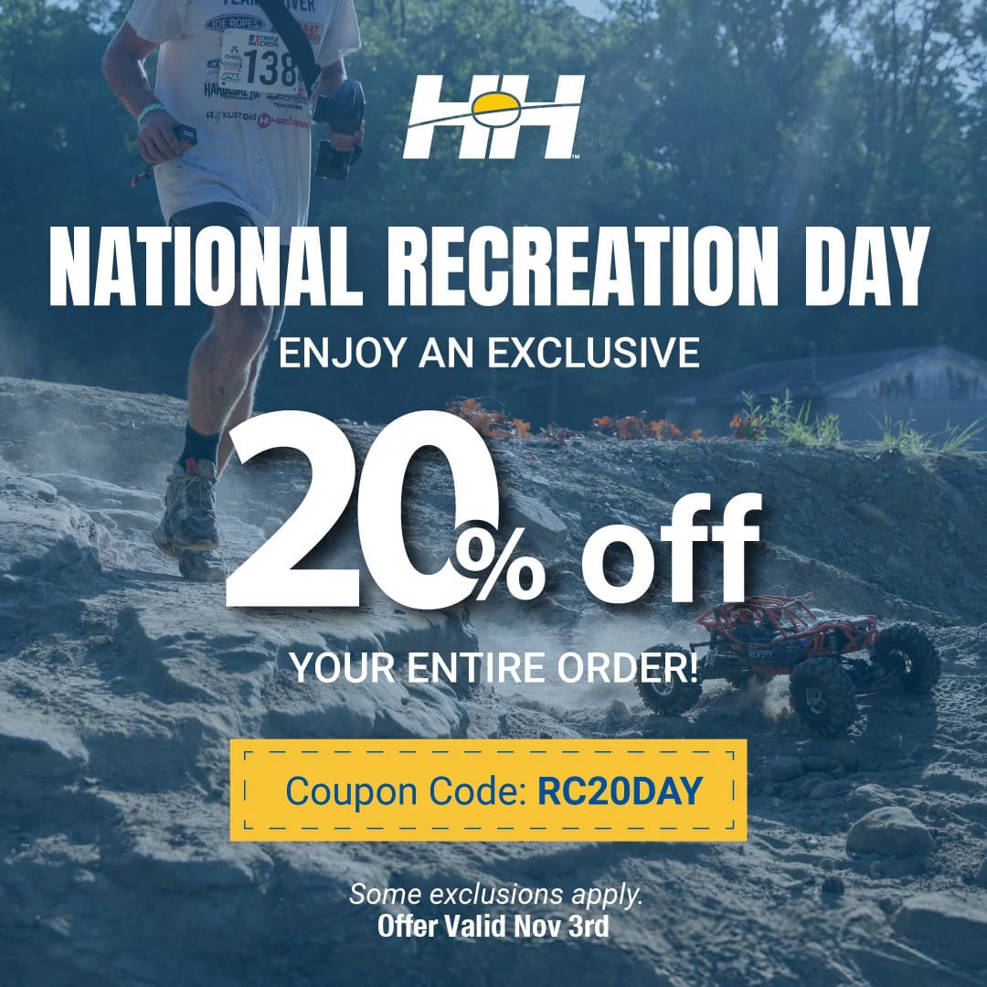 RC off-road RC car on rocky terrain during a race event, promoting RC Newb’s special discount for National Recreation Day.