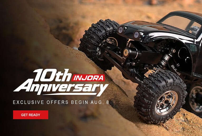 RC off-road vehicle climbing a dirt incline, celebrating 10th anniversary with exclusive offers from INJORA starting August 8.