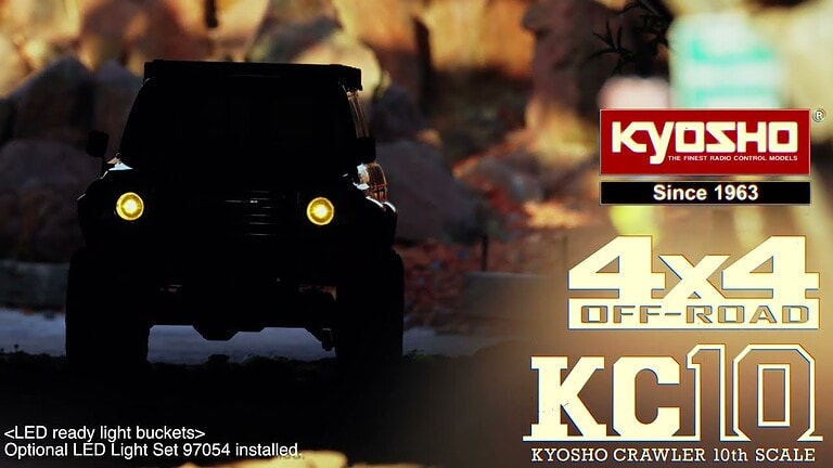 Detailed image of Kyosho's 1/10 scale Toyota Land Cruiser exploring a diorama field in Japan, showcasing off-road capabilities and realistic design.