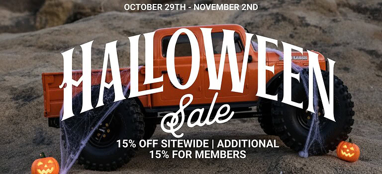Halloween sale promotional Jeep toy on sandy background with pumpkins and cobwebs for Halloween themed discounts.