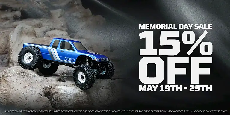 RC off-road truck navigating rocky terrain during Memorial Day sale.
