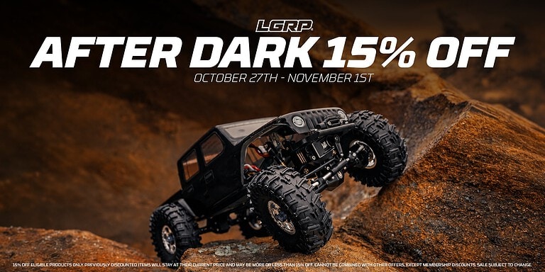 RC Newb off-road vehicle tackling rugged terrain with large tires mid-action during a special After Dark sale.