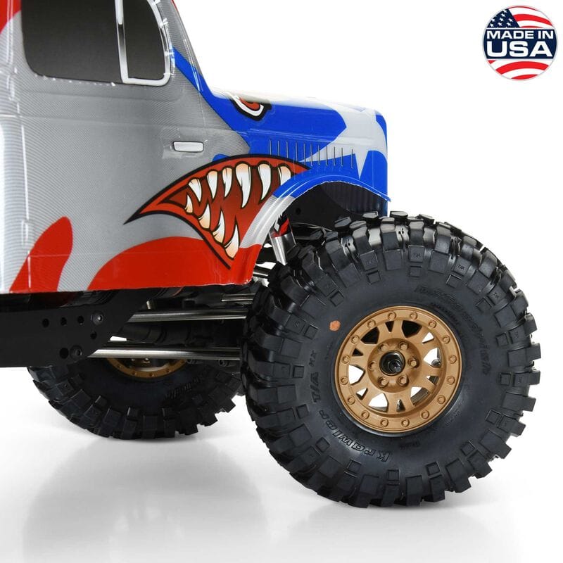 RC monster truck with aggressive tire treads, custom shark mouth graphic, and USA-made decals, ideal for off-road racing and rugged terrain, featuring durable construction and high performance.