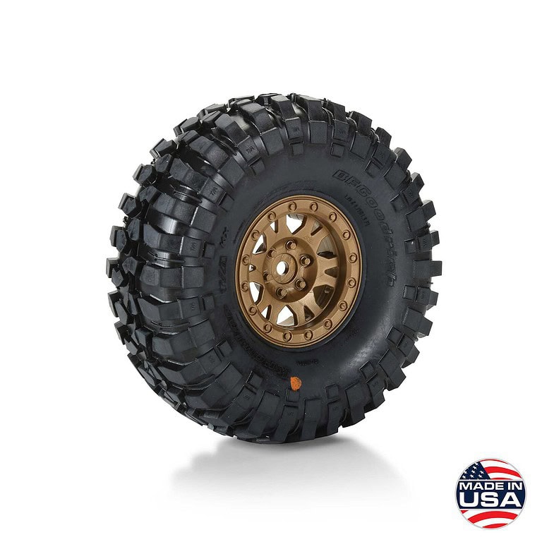 Off-road RC tire with aggressive tread pattern and gold alloy wheel, ideal for RC trucks and vehicles, designed for durability and maximum traction on rough terrains.