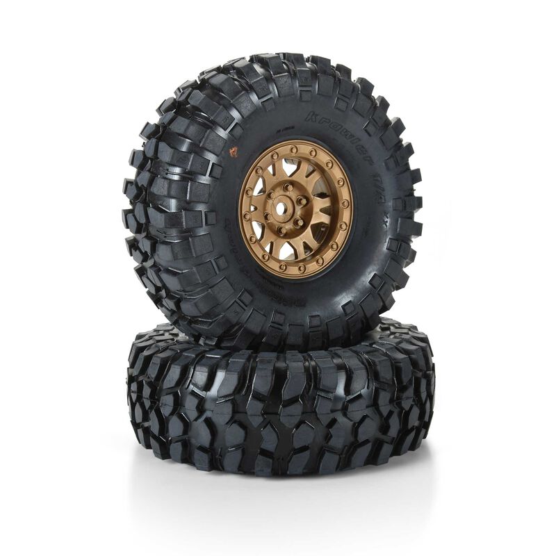 Robust off-road RC tires with gold rims, ideal for RC trucks and crawlers, showcasing durable rubber and aggressive tread pattern for optimal traction on rough terrains.