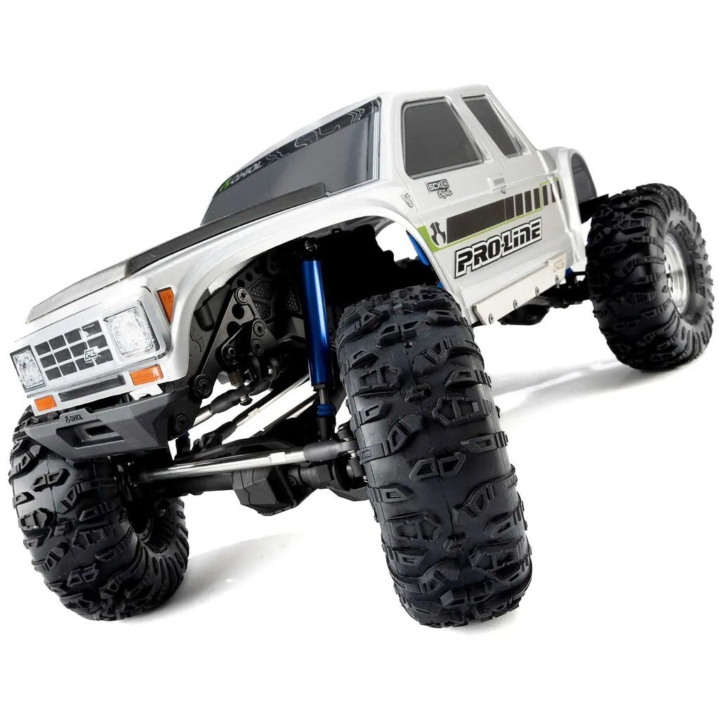 Detailed view of a Pro-Line RC truck with large off-road tires and suspension system, showcasing durability and performance for RC enthusiasts.