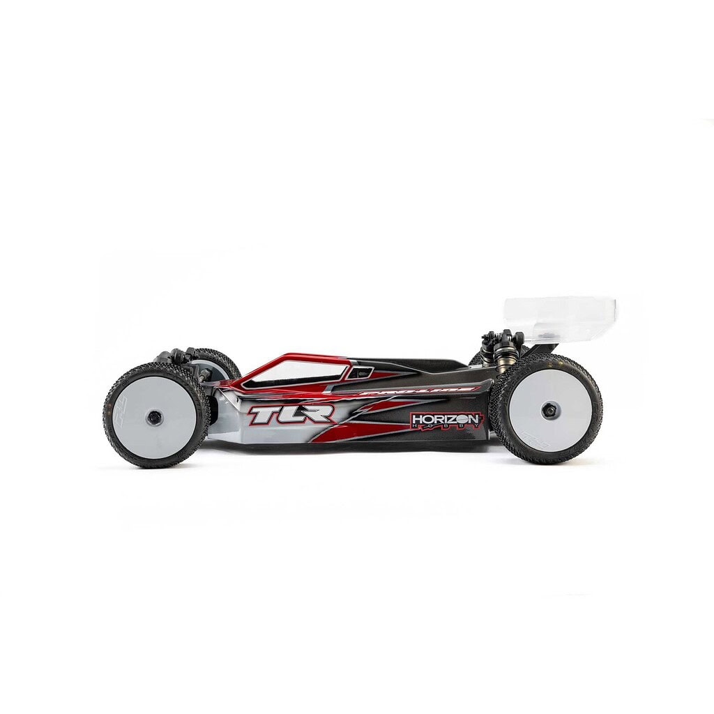 High-performance RC car with sleek black and red design, suitable for racing and hobby use, featuring durable tires and aerodynamic body.