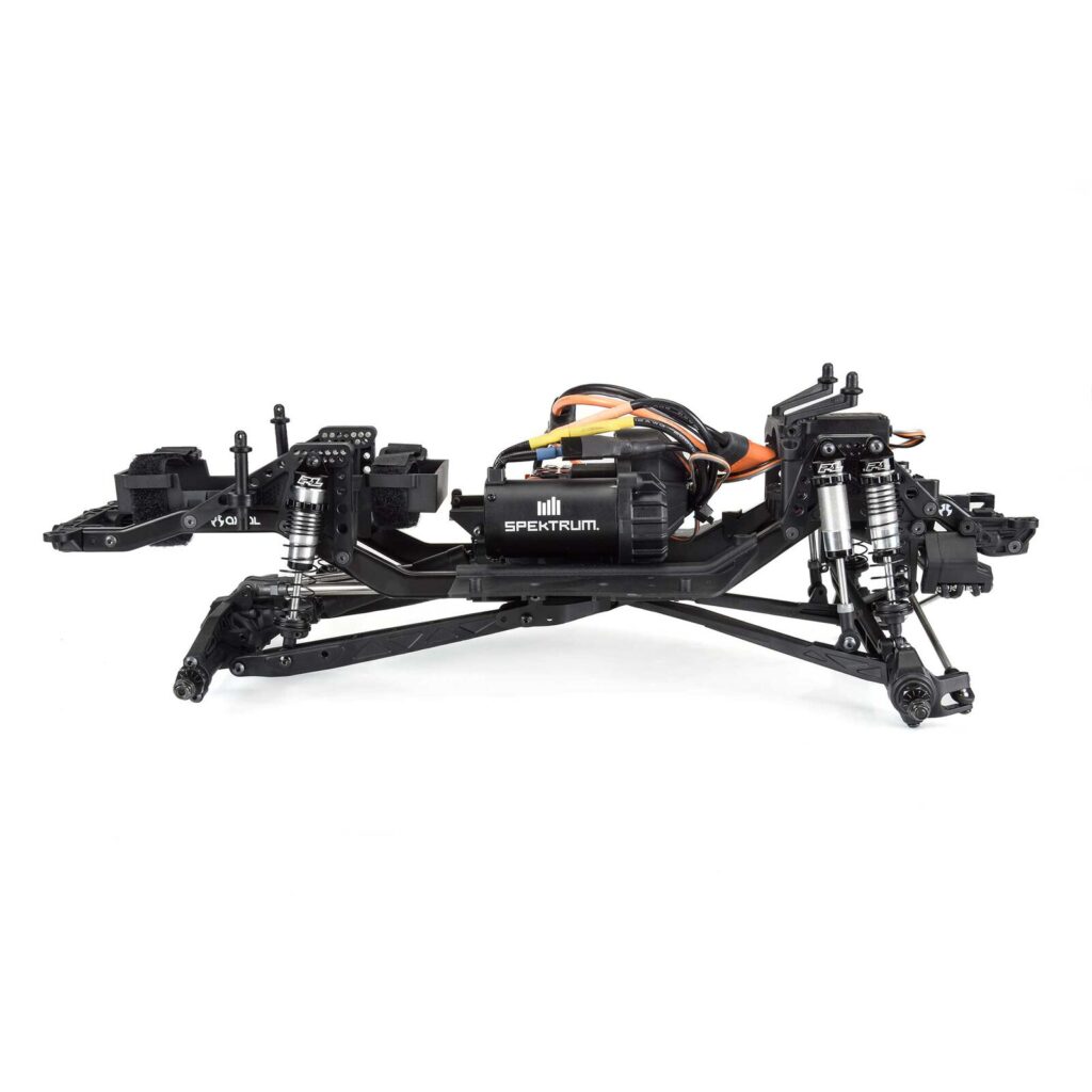 High-performance RC car chassis with Spektrum motor, precision shocks, and lightweight frame, ideal for RC racing and hobbyists. Provides stability and speed for competitive RC driving.
