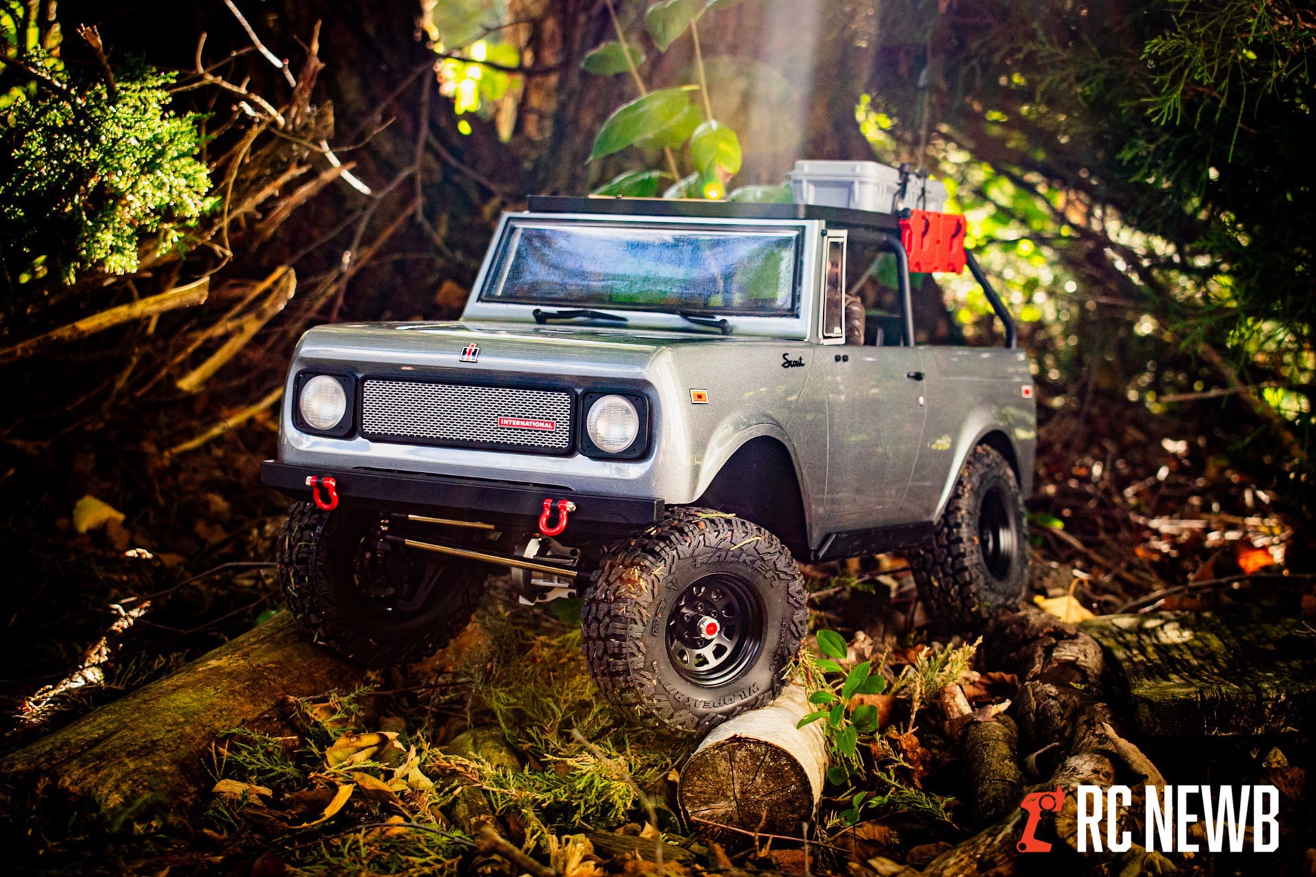 Realistic RC off-road vehicle in a forest setting, rugged tires, detailed exterior, remote control car perfect for outdoor adventures, RC Newb branding, exploring nature with RC trucks and cars.