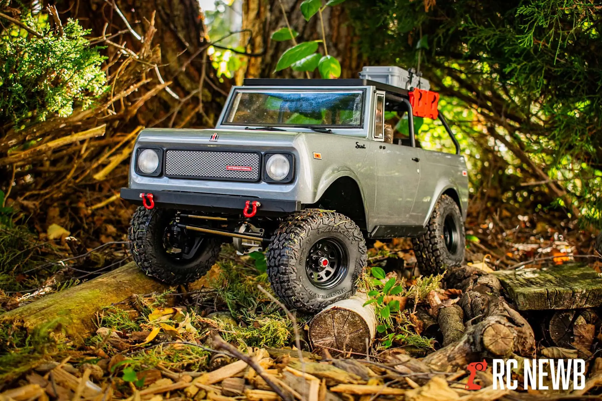 Off-road RC truck navigating forest terrain with rugged tires and detailed design, perfect for RC car enthusiasts and remote control vehicle hobbyists.
