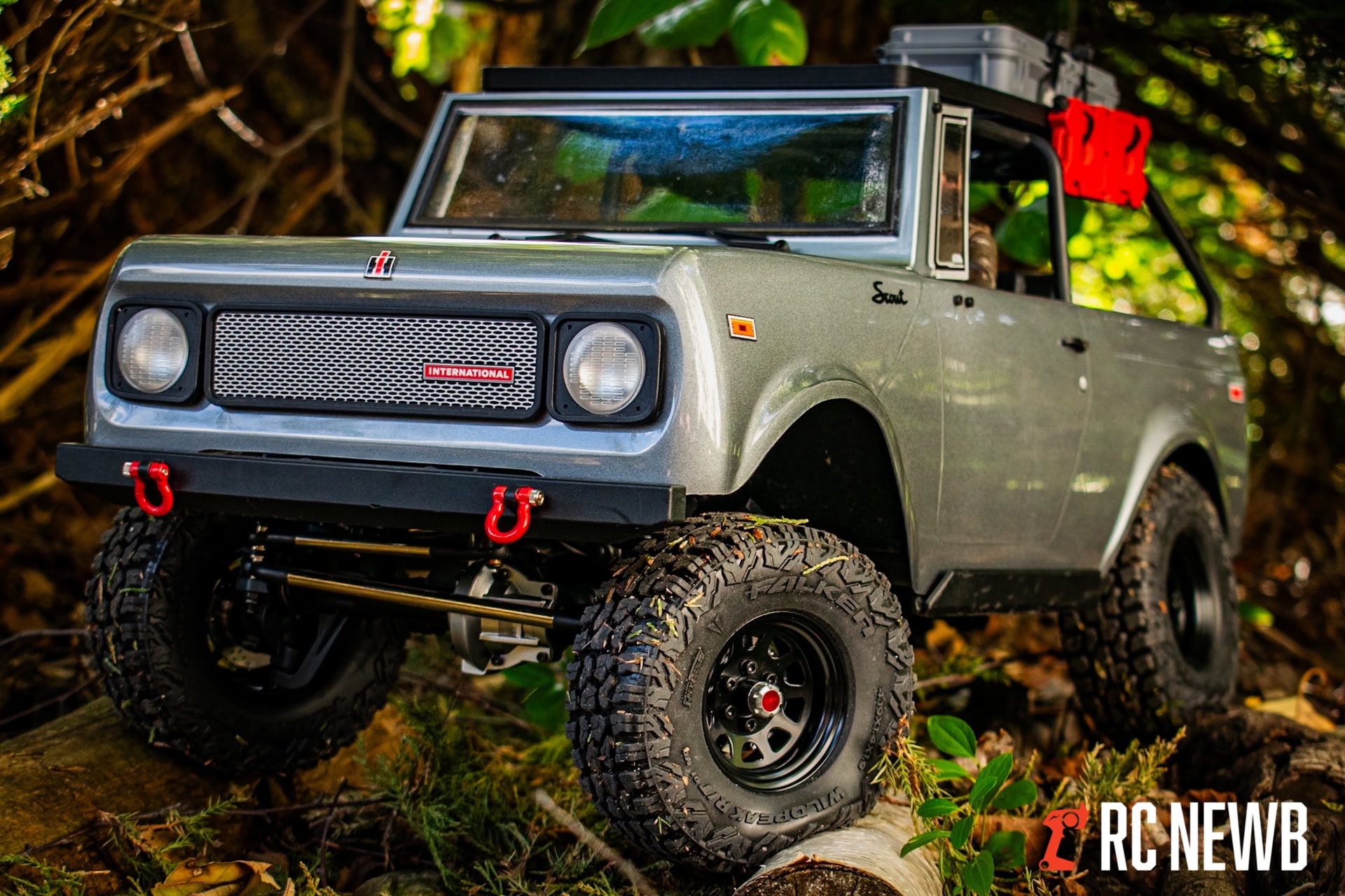 Off-road RC truck with rugged tires and detailed exterior on natural forest terrain, showcasing scale model RC vehicle for off-road adventures.