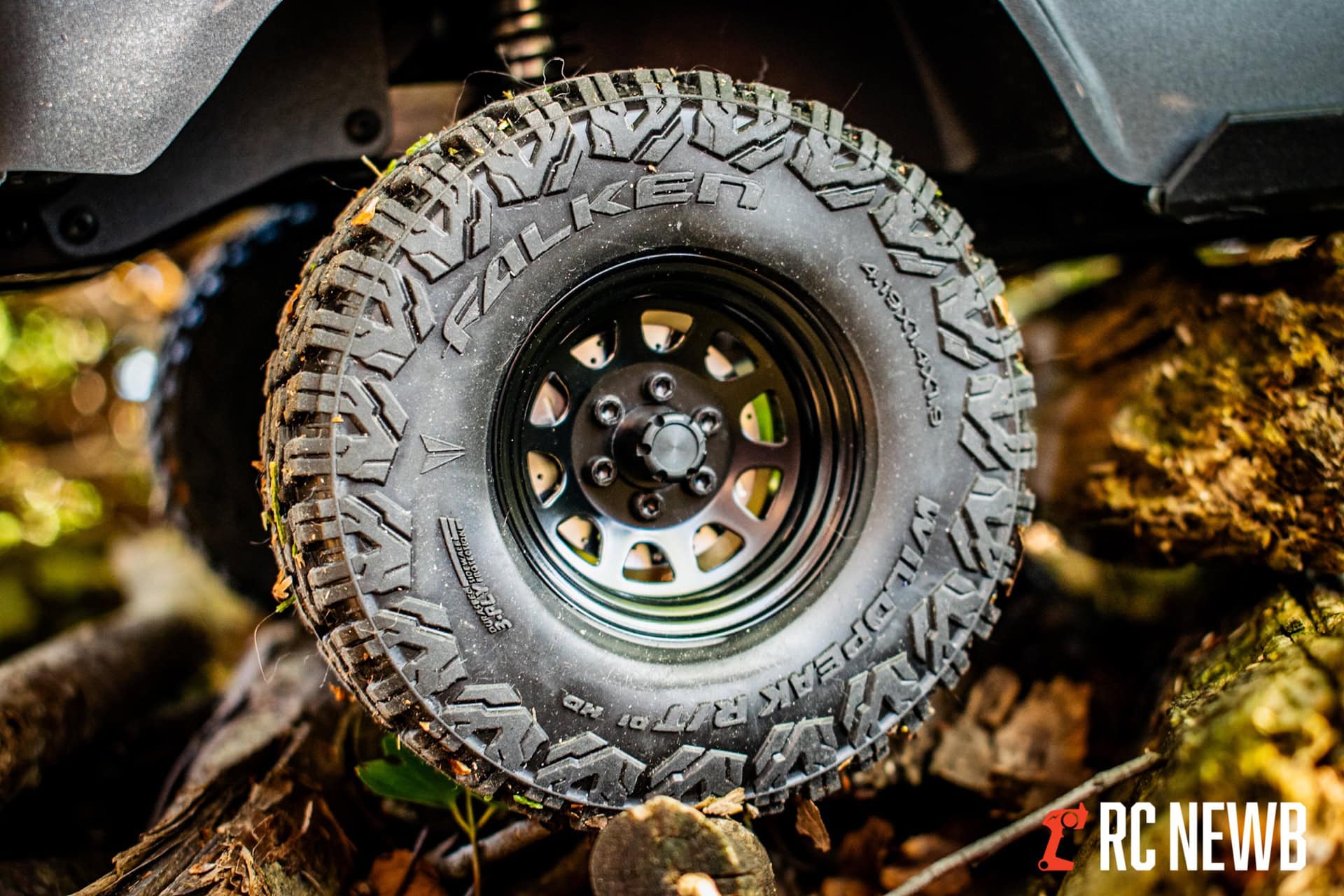 All-Terrain Falken Wildpeak tire mounted on RC truck wheel for off-road adventures.