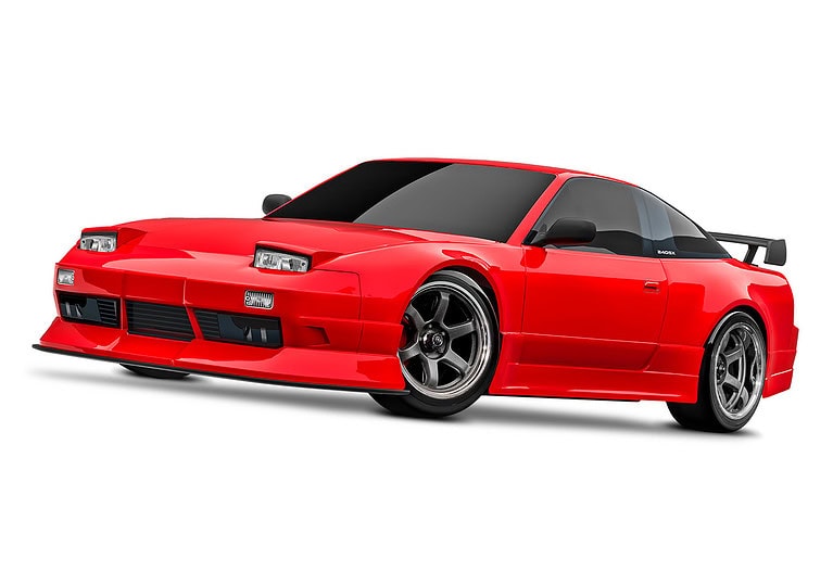 A red classic sports car featuring a wide body, aerodynamic styling, lowered suspension, and custom alloy wheels, perfect for car enthusiasts and RC hobbyists interested in scale models.